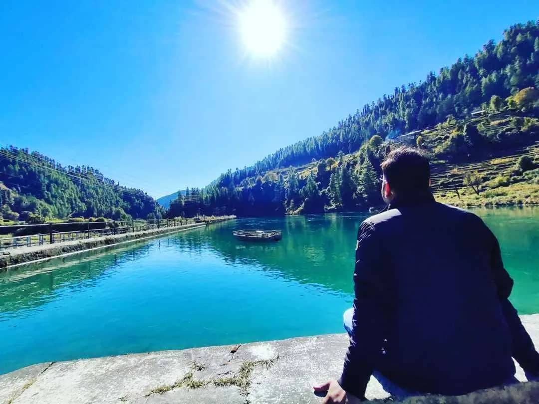 Relaxing by the water in Barot Valley